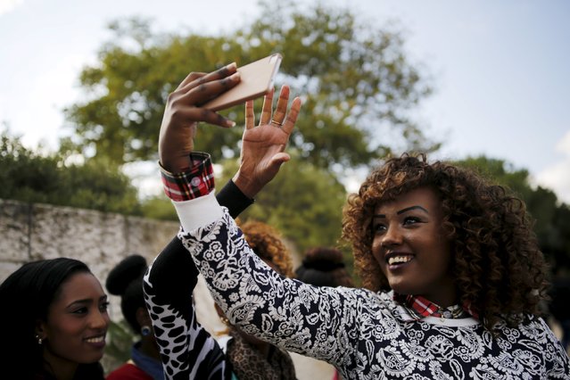 Members of the Ethiopian Jewish community in Israel take a selfie during a ceremony marking the holiday of Sigd in Jerusalem November 11, 2015. (Photo by Amir Cohen/Reuters)