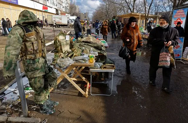 People shop at a local market in the course of Russia-Ukraine conflict in Mariupol, Russian-controlled Ukraine on February 16, 2023. (Photo by Alexander Ermochenko/Reuters)