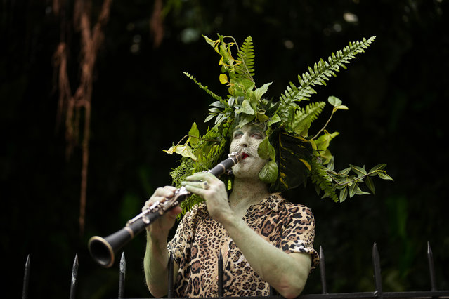A man plays an oboe during a social event at the Casa Ecuador ahead of the 2024 Summer Olympics, in Paris, July 25, 2024. (Photo by Francisco Seco/AP Photo)