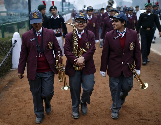 National Cadet Corps (NCC) cadets walk after taking part in the rehearsal for the Republic Day parade on a winter morning in New Delhi January 21, 2015. (Photo by Ahmad Masood/Reuters)
