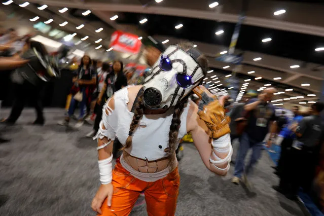 An attendee dressed as a character from the Borderlands games poses for a picture during opening day of pop culture convention Comic Con International in San Diego, USA on Thursday, July 19, 2018. (Photo by Mike Blake/Reuters)