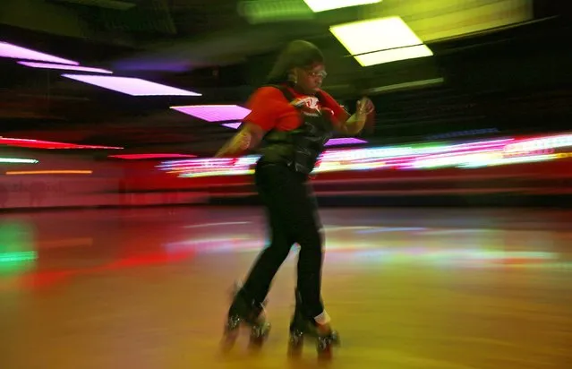 A woman dances on roller skates at “The Rink” during an evening session in Chicago, Illinois, January 15, 2015. (Photo by Jim Young/Reuters)