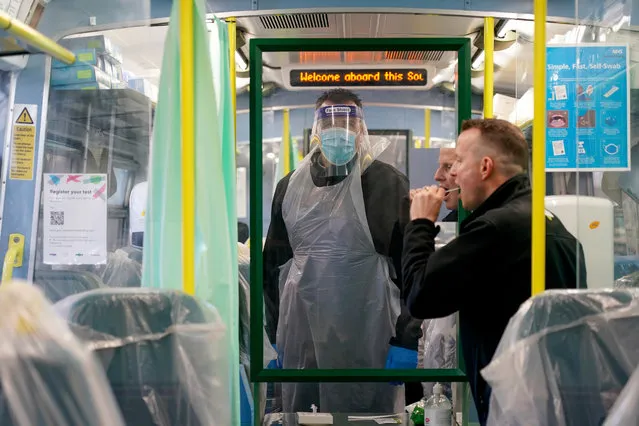 Railway staff carry out lateral flow covid tests on colleagues in a temporary testing facility on a converted train parked on platform eight of Brighton railway station on March 19, 2021 in Brighton, England. Govia Thameslink Railway have set up a Covid-19 testing centre for railway staff operating from a Southern Railway train carriage at Brighton Station's platform eight. Staff from Southern, Thameslink, Great Northern and Gatwick Express can get twice-weekly lateral flow tests giving results within half an hour. (Photo by Chris Eades/Getty Images)