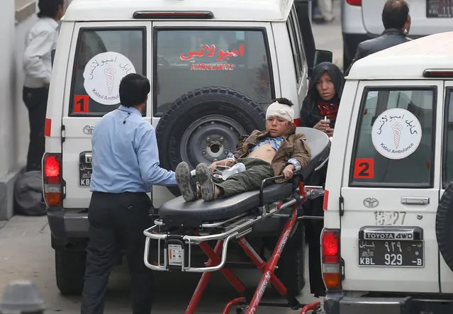 An injured boy is transported to a hospital after a suicide attack in Kabul, Afghanistan November 21, 2016. (Photo by Mohammad Ismail/Reuters)