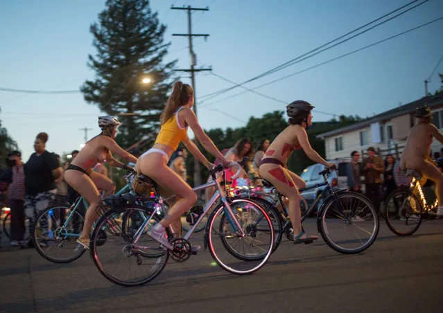 Cyclists take part in the annual “World Naked Bike Ride” on June 23, 2018 in Portland, Oregon. (Photo by Natalie Behring/Getty Images)