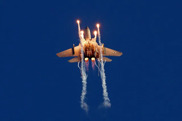 Israel's F-15 Eagle fighter plane performs during the graduation ceremony of Israeli Air Force pilots at the Hatzerim base in the Negev desert, near the southern city of Beer Sheva, on June 29, 2023. (Photo by Jack Guez/AFP Photo)