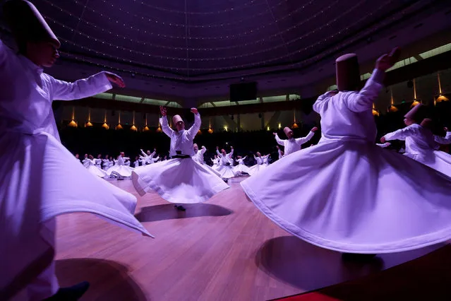 Whirling dervishes perform a traditional “Sema” ritual during a ceremony, one of many marking the 743rd anniversary of the death of Mevlana Jalaluddin Rumi, at Mevlana Cultural Center in Konya, Turkey, December 7, 2016. (Photo by Murad Sezer/Reuters)