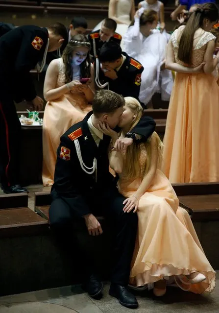 A cadet kisses a girl during a break of the Kremlin Cadet Ball in Moscow, Russia, 08 December 2016. (Photo by Sergei Chirikov/EPA)