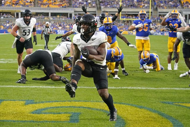 Cincinnati running back Corey Kiner scores a touchdown against Pittsburgh during the first half of an NCAA college football game in Pittsburgh on Saturday, September 9, 2023. (Photo by Gene J. Puskar/AP Photo)