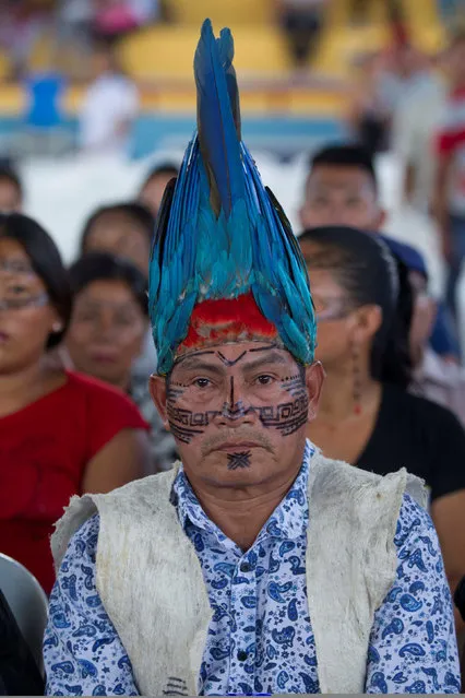 An Ecuadorian Shiwia Indian man attends an intercultural Amazonian political rally in Tena December 20, 2016. (Photo by Guillermo Granja/Reuters)