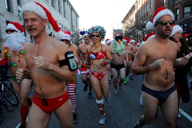 Participants leave the starting line for the annual Santa Speedo Run through the Back Bay neighbourhood in Boston, Massachusetts, U.S., December 8, 2018. (Photo by Brian Snyder/Reuters)