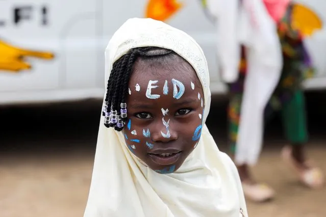 A girl celebrates the Muslim festival of Eid al-Adha in the Kibera slum in Nairobi, Kenya, July 20, 2021. (Photo by Baz Ratner/Reuters)