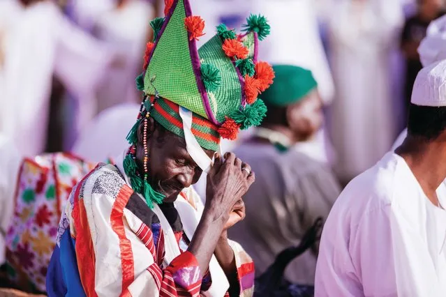 A woman in the crowd explains why green is such a significant colour for the Sufi order. “I’m wearing a beautiful green jalabiya. It was a gift from my sheikh, and looks like the typical great Sufi dresses. It symbolises the simplicity and the calm of Sufism, and its charm and beauty”. Most cloaks and garments, she says, are bestowed to the dervishes by the order’s sheikh during formal initiation ceremonies. (Photo by Ala Kheir, John Burns and Ibrahim Algrefwi/Brownbook)