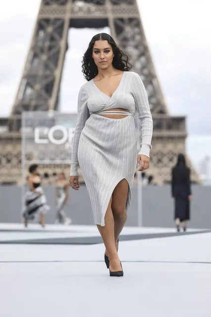 A model wears a creation for the L'Oreal Spring-Summer 2022 ready-to-wear fashion show presented in Paris, Sunday, Oct. 3, 2021. (Photo by Vianney Le Caer/Invision/AP)