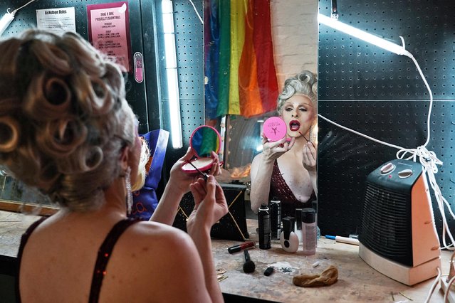 Drag queen Dakota Fann'ee prepares to host a drag trivia night at the Imperial Erskineville bar, as coronavirus disease (COVID-19) lockdown restrictions gets lifted for vaccinated residents, in Sydney, Australia, October 13, 2021. (Photo by Loren Elliott/Reuters)