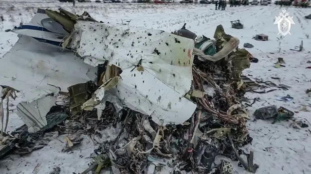 In this photo taken from video released by Russian Investigative Committee on Thursday, Jan. 25, 2024, the wreckage of the Il-76 is seen near Yablonovo, Belgorod region of Russia, Thursday, January 25, 2024. Russia and Ukraine are trading accusations over the crash of a military transport plane that Moscow said was carrying Ukrainian prisoners of war and was shot down by Kyiv's forces. The Il-76 crashed in a huge ball of fire in a rural area of Russia, and authorities there said all 74 people on board, including 65 POWs, six crew and three Russian servicemen, were killed. (Photo by Russian Investigative Committee via AP Photo)
