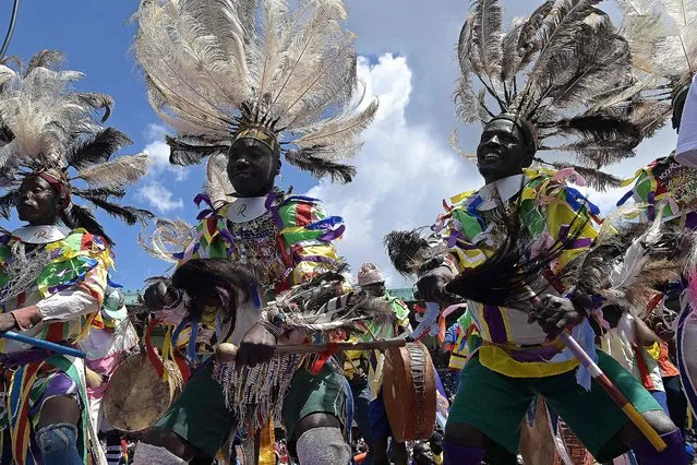 Traditional dancers perform at the Azimio la Umoja (Declaration of Unity) rally at which opposition leader Raila Odinga announced he would make his fifth bid for the presidency in Kenya's 2022 general election, in Nairobi, December 10, 2021. Veteran Kenyan politician Raila Odinga's announcement to run for a fifth bid for the presidency in a general election scheduled for August 9, 2022, ends months of suspense following a surprise truce with his former foe, the incumbent president. (Photo by Simon Maina/AFP Photo)