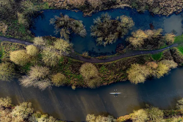 Rowers move upstream along the River Avon at Conham River Park, Bristol on Sunday, January 2, 2022, where the mild winter weather continues after Britain enjoyed the warmest new year on record. (Photo by Ben Birchall/PA Images via Getty Images)