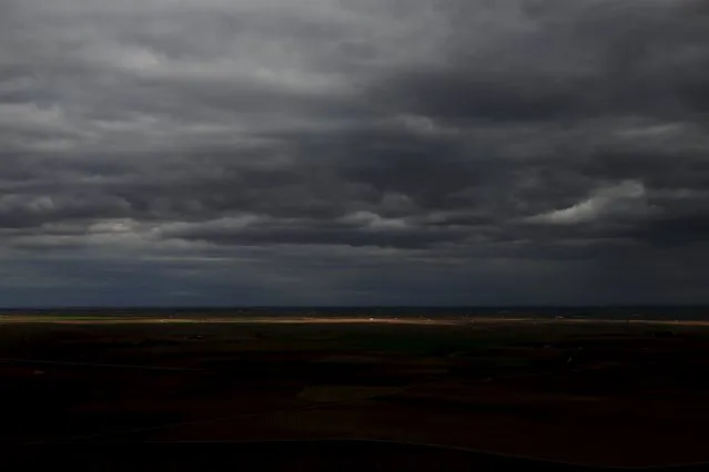 The vast plains of La Mancha are seen from El Cerro de San Anton (Saint Anthony's hill) outside Alcazar de San Juan, Spain, April 5, 2016. (Photo by Susana Vera/Reuters)