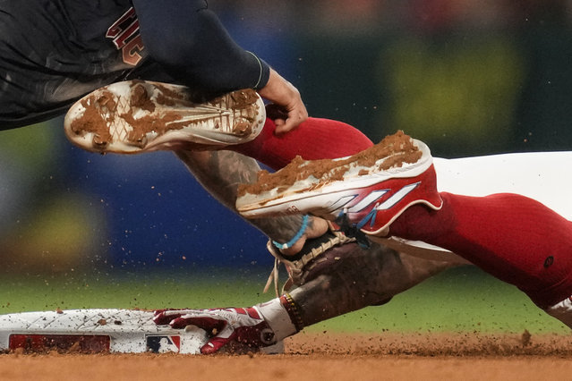 Los Angeles Angels' Zach Neto, right, is caught stealing second by Cleveland Guardians shortstop Brayan Rocchio, left, during the seventh inning of a baseball game in Anaheim, Calif., Saturday, May 25, 2024. (Photo by Ashley Landis/AP Photo)