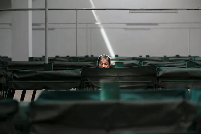 A woman works at the Kim Jong Suk Pyongyang textile mill during a government organised visit for foreign reporters in Pyongyang, North Korea May 9, 2016. (Photo by Damir Sagolj/Reuters)