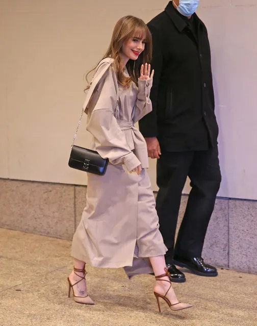 “Emily in Paris” star Lily Collins steps out of CBS Mornings studio in Times Square, New York City on March 22, 2022. The Emily in Paris star wore a tan jacket, matching skirt, and heels. (Photo by The Image Direct)