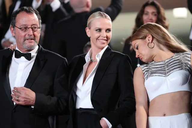 Actor Jean Reno, actresses Charlize Theron and Adele Exarchopoulos leave the “The Last Face” premiere during the 69th annual Cannes Film Festival at the Palais des Festivals on May 20, 2016 in Cannes, France. (Photo by Andreas Rentz/Getty Images)
