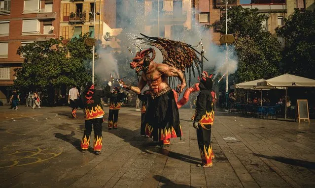 “Atzeries” the fire beast sets of its flying sparks inaugurating the “Festa Major de Gracia” in Spain on August 15, 2021. This unannounced cavalcade through Barcelona's Gracia quarter was the beginning of a reduced and restricted version of this famous festival due to the ongoing COVID-19 crisis. (Photo by Matthias Oesterle/ZUMA Press Wire/Rex Features/Shutterstock)