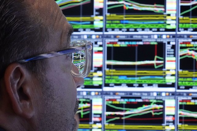 The monitor of specialist Anthony Matesic is seen through his glasses as he works on the floor of the New York Stock Exchange, Wednesday, August 7, 2024. (Photo by Richard Drew/AP Photo)