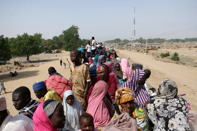 Refugees wait on top of a truck in the Muna Garage area in the northeastern Nigerian city of Maiduguri, Nigeria  February 16, 2017. (Photo by Paul Carsten/Reuters)