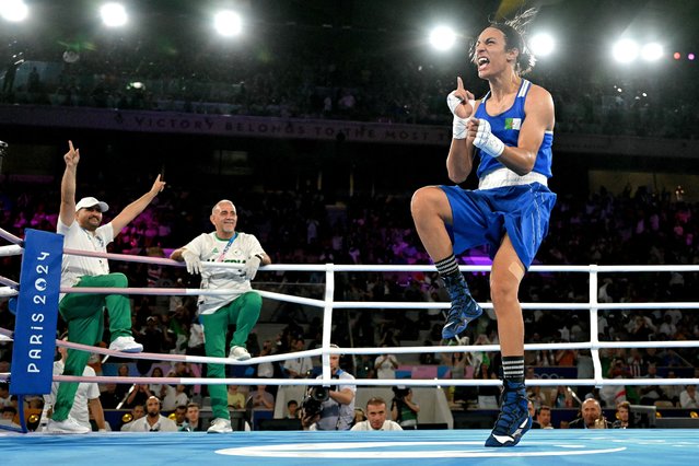 Algeria's Imane Khelif (Blue) reacts after beating Thailand's Janjaem Suwannapheng in the women's 66kg semi-final boxing match during the Paris 2024 Olympic Games at the Roland-Garros Stadium, in Paris on August 6, 2024. (Photo by Mohd Rasfan/AFP Photo)