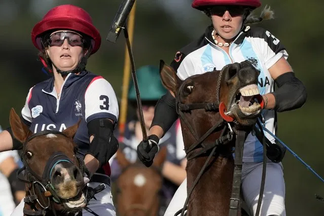 Jenna Davis of the United States, left, and Argentina's Catalina Laivinia, compete during the final match of the Women's Polo World Championship, in Buenos Aires, Argentina, Saturday, April 16, 2022. Six countries faced off at the Campo Argentino de Polo in the first women's polo world championship tournament. Argentina went on to win the title. (Photo by Natacha Pisarenko/AP Photo)