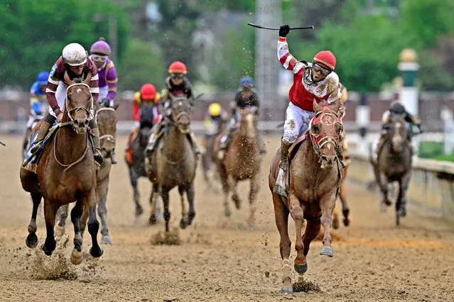 Sonny Leon aboard Rich Strike celebrates winning the 148th running of the Kentucky Derby at Churchill Downsin  Louisville, KY. on May 7, 2022. (Photo by Jamie Rhodes/USA TODAY Sports)