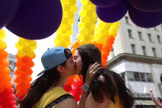 Girls kiss during the annual New York Gay Pride Parade, one of the oldest and largest in the world on June 25, 2017 in New York City. (Photo by Vanessa Carvalho/Brazil Photo Press/LatinContent/Getty Images)