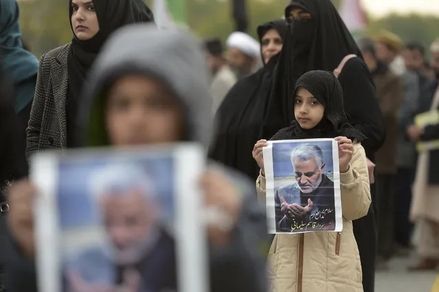 Protesters carry posters with the image of top Iranian commander Qasem Soleimani, who was killed in a US airstrike in Iraq, during a demonstration in Islamabad on January 3, 2020. A US strike killed top Iranian commander Qasem Soleimani at Baghdad's international airport On January 3, dramatically heightening regional tensions and prompting arch enemy Tehran to vow “revenge”. (Photo by Aamir Qureshi/AFP Photo)