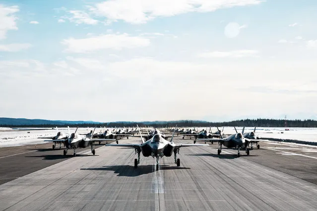 A formation of 42 F-35A Lightning II’s, 354th Fighter Wing, during a routine readiness exercise at Eielson Air Force Base, Alaska on March 25, 2022. The capabilities demonstration represents the culmination of the dedicated efforts of the 354th Fighter Wing, with each Airman providing vital contributions to ensure Team Eielson is ready to deliver airpower anytime, anywhere. (Photo by Jose Miguel/South West News Service)