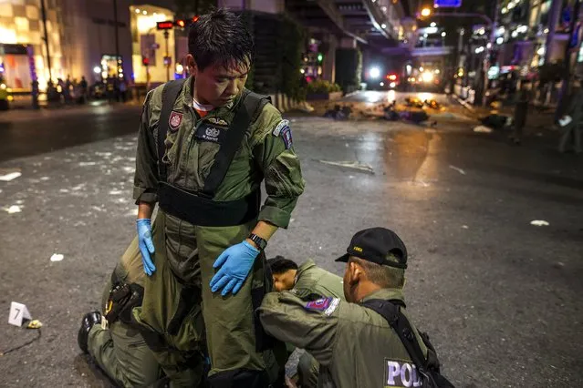 Experts prepare to enter the scene and investigate around the Erawan shrine, the site of a deadly blast in central Bangkok August 17, 2015. (Photo by Athit Perawongmetha/Reuters)
