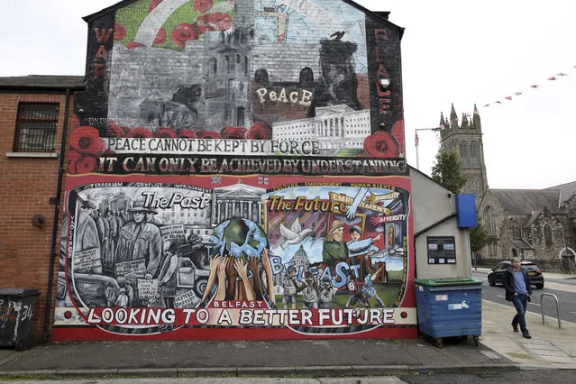 In this Tuesday, October 15, 2019 file photo showing a Loyalist mural painted on a wall in east Belfast, Northern Ireland. Rory Finnis was only 21 years old when he was killed in 1991 by the Irish Republican Army. Accused of “informing” the Northern Ireland government of the paramilitary group’s activities, the boy from Londonderry was shot in the head. His hands had been tied behind his back and his eyes taped closed. Details of Finnis’ death, along with many others, have been revealed in archives newly opened by the Public Records Office of Northern Ireland. The files concern the violent period known as “The Troubles”, which centred on whether Northern Ireland would be part of the United Kingdom, as it is today, or join the Republic of Ireland. (Photo by Peter Morrison/AP Photo/File)