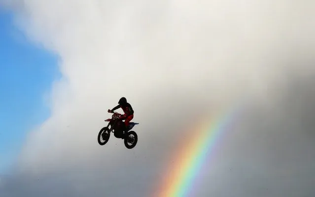 Richard Sikyna of Slovakia makes a jump as a rainbow forms behind in the MX2 race during the 2020 FIM MXGP World Championships on March 01, 2020 in Winchester, England. (Photo by Julian Finney/Getty Images)
