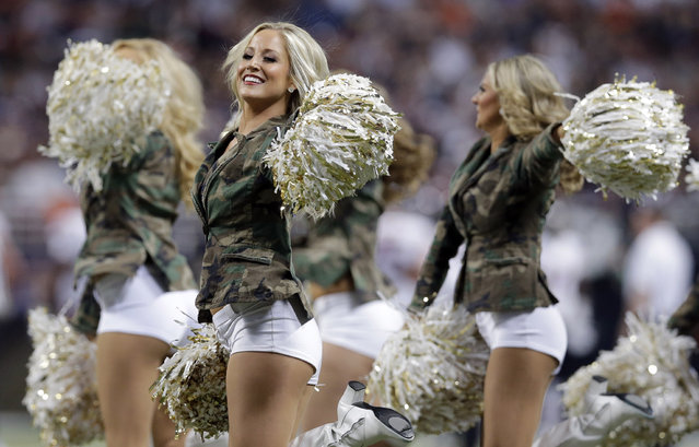 St. Louis Rams cheerleaders perform during the first quarter of an NFL football game between the St. Louis Rams and the Chicago Bears on Sunday, November 24, 2013, in St. Louis. (Photo by Nam Y. Huh/AP Photo)