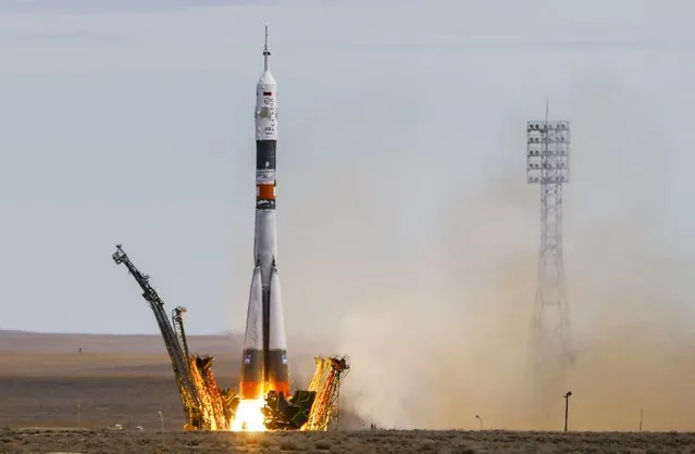 The Soyuz TMA-18M spacecraft carrying the crew of Aidyn Aimbetov of Kazakhstan, Sergei Volkov of Russia and Andreas Mogensen of Denmark blasts off from the launch pad at the Baikonur cosmodrome, Kazakhstan, September 2, 2015. (Photo by Shamil Zhumatov/Reuters)