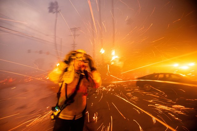 Firefighters battle the Palisades Fire as it burns during a windstorm on the west side of Los Angeles, California, U.S. January 7, 2025. (Photo by Ringo Chiu/Reuters)