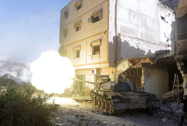A military vehicle belonging to the Libyan National Army fires towards the positions of Islamist militants during clashes in Khreibish district in Benghazi, Libya, November 9, 2017. (Photo by Esam Omran Al-Fetori/Reuters)