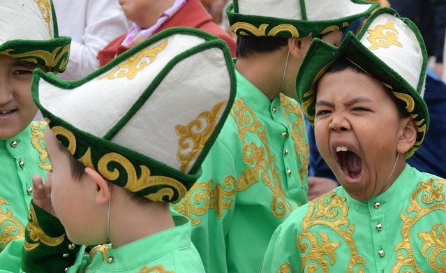 People attend celebrations marking the Day of the Kyrgyz national “Ak-kalpak” hat at the central Ala-Too Square in Bishkek on March 4, 2021. (Photo by Vyacheslav Oseledko/AFP Photo)