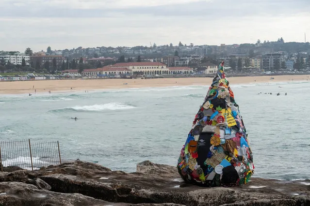 Australian-based artist, Marina DeBris' latest sculpture, “A Drop in the Ocean, Said 7.8 Billion People”, installed at the 2022 Sculpture by the Seas exhibition in Sydney, Australia on October 19, 2022. (Photo by Cordelia Hsu/Reuters)