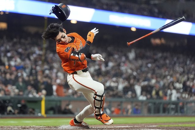 San Francisco Giants' Jung Hoo Lee reacts after swinging at a pitch by Texas Rangers pitcher Robert Garcia, which struck Lee out, during the ninth inning of a baseball game in San Francisco, Friday, April 25, 2025. (Photo byh Jeff Chiu/AP Photo)