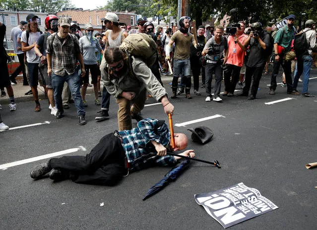 Counter demonstrators attack a white supremacist during a rally in Charlottesville, Virginia, August 12, 2017. (Photo by Joshua Roberts/Reuters)