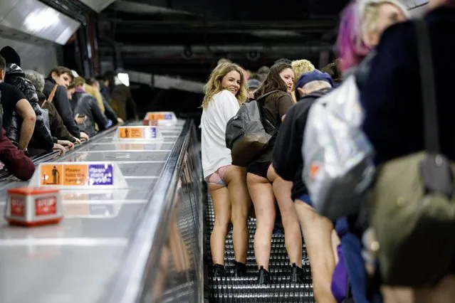 Passengers wear no trousers as they ride the London Underground in London, Britain, 07 January 2018. (Photo by Tolga Akmen/EPA/EFE)