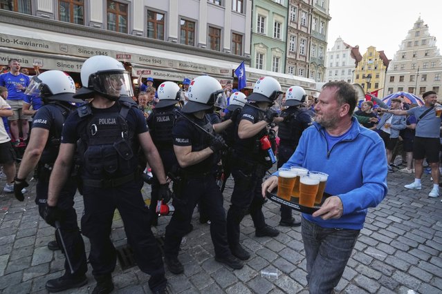 Riot police confront Chelsea fans ahead of the Europa Conference League final soccer match between Real Betis and Chelsea in Wroclaw, Poland, Tuesday, May 27, 2025. (Photo by Czarek Sokolowski/AP Photo)