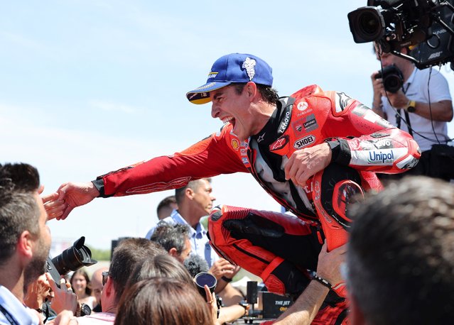 Team Ducati Lenovo Team's Marc Marquez celebrates on the podium winning the sprint race of the MotoGP Aragon Grand Prix at the Motorland circuit in Alcaniz, northeastern Spain, on June 7, 2025. (Photo by Lluis Gene/AFP Photo)